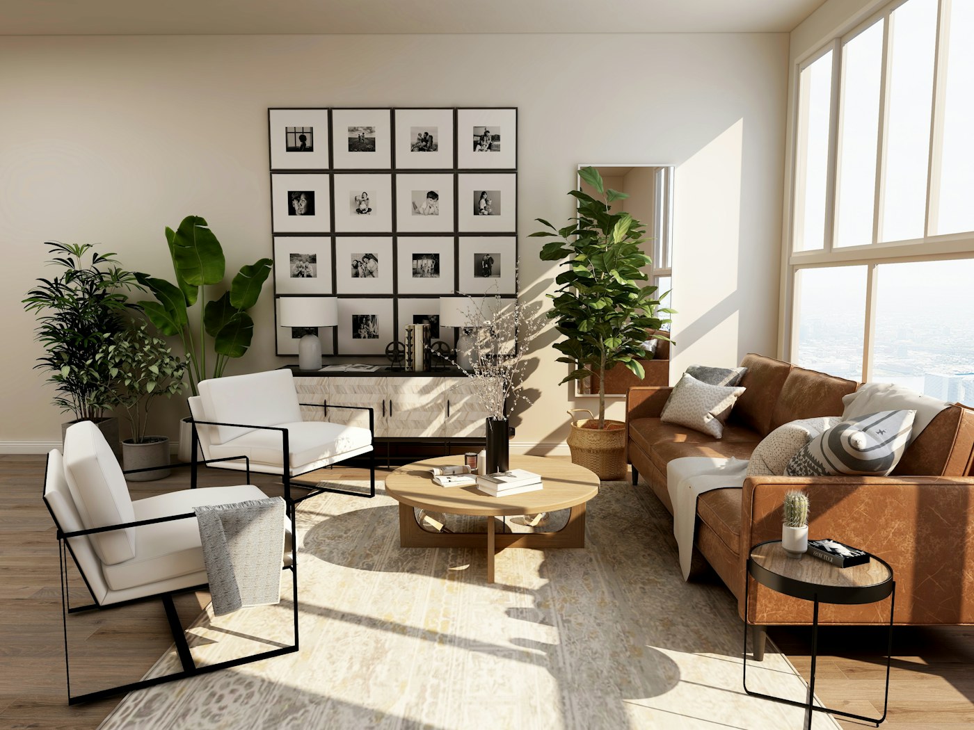 Modern living room with a tan leather sofa, white armchairs and a framed gallery wall